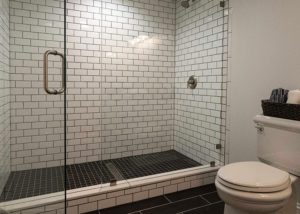 shower enclosure with white subway tile
