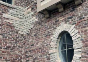 Custom built luxury home - brick and stone detail on front of home