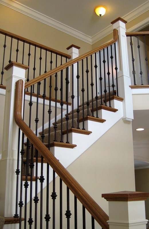 Custom staircase with black iron spindles