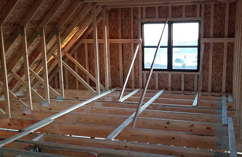 Rooms are framed out with studs on second floor