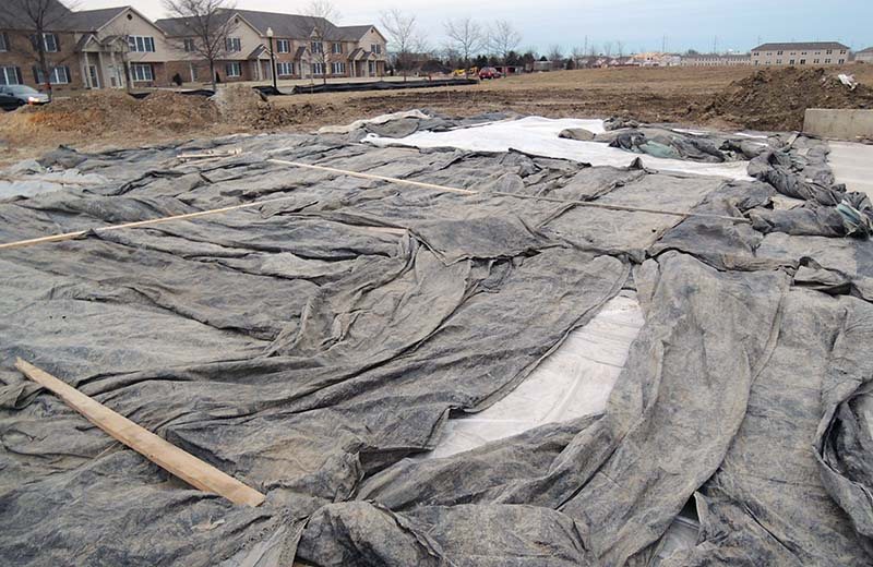 tarps protecting concrete during cure time