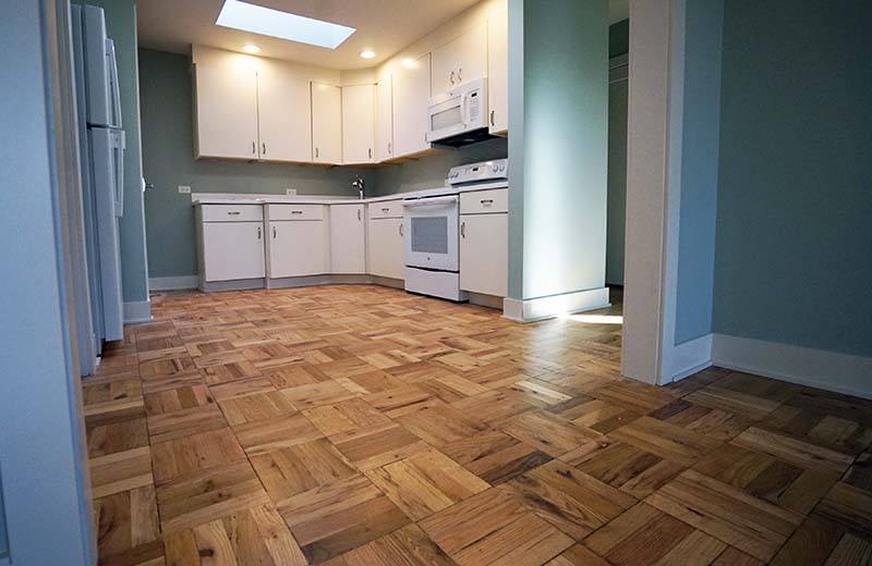 Scholl Construction apartment living room into kitchen after