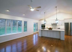 Great room featuring bow window and remodeled kitchen