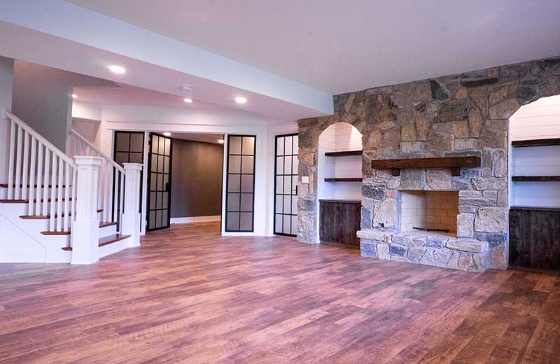 Finished Basement with Stone Fireplace