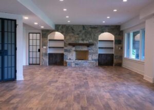 Basement remodel with stone fireplace