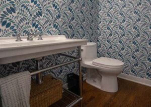Powder room with blue wallpaper