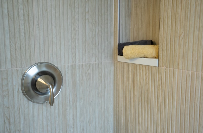 Tile details in shower - tan tile that looks like wood