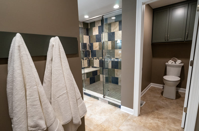 Master Shower Area with Storage and Private Toilet