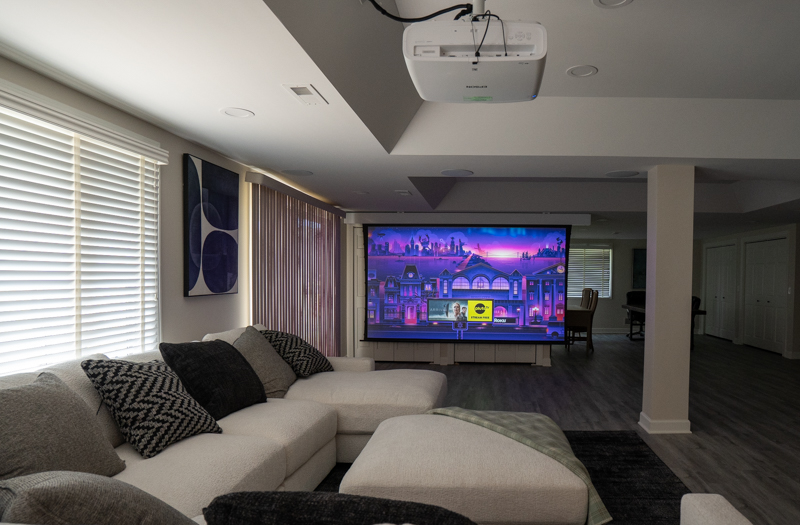 retractable screen in entertainment area for watching movies, sports and television