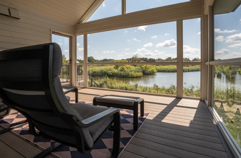 Screened in porch overlooking lake
