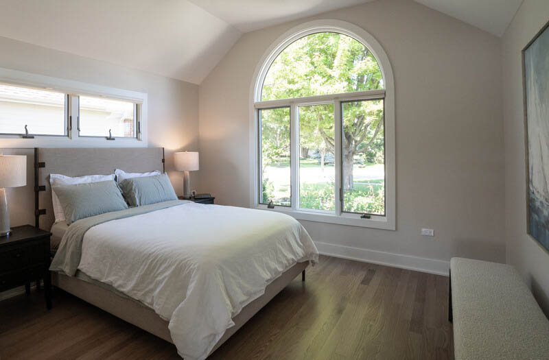 Guest bedroom with large front window